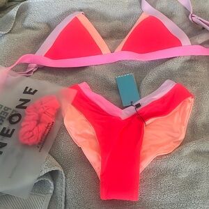 Brand new bathing suit. Large top small bottoms.  Never worn. Was a gift.